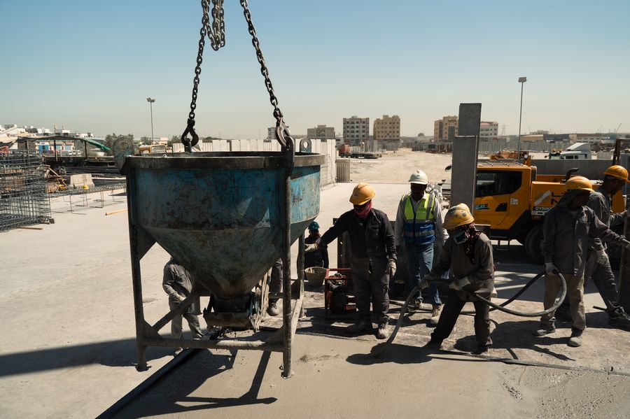 Concrete poured by crane bucket